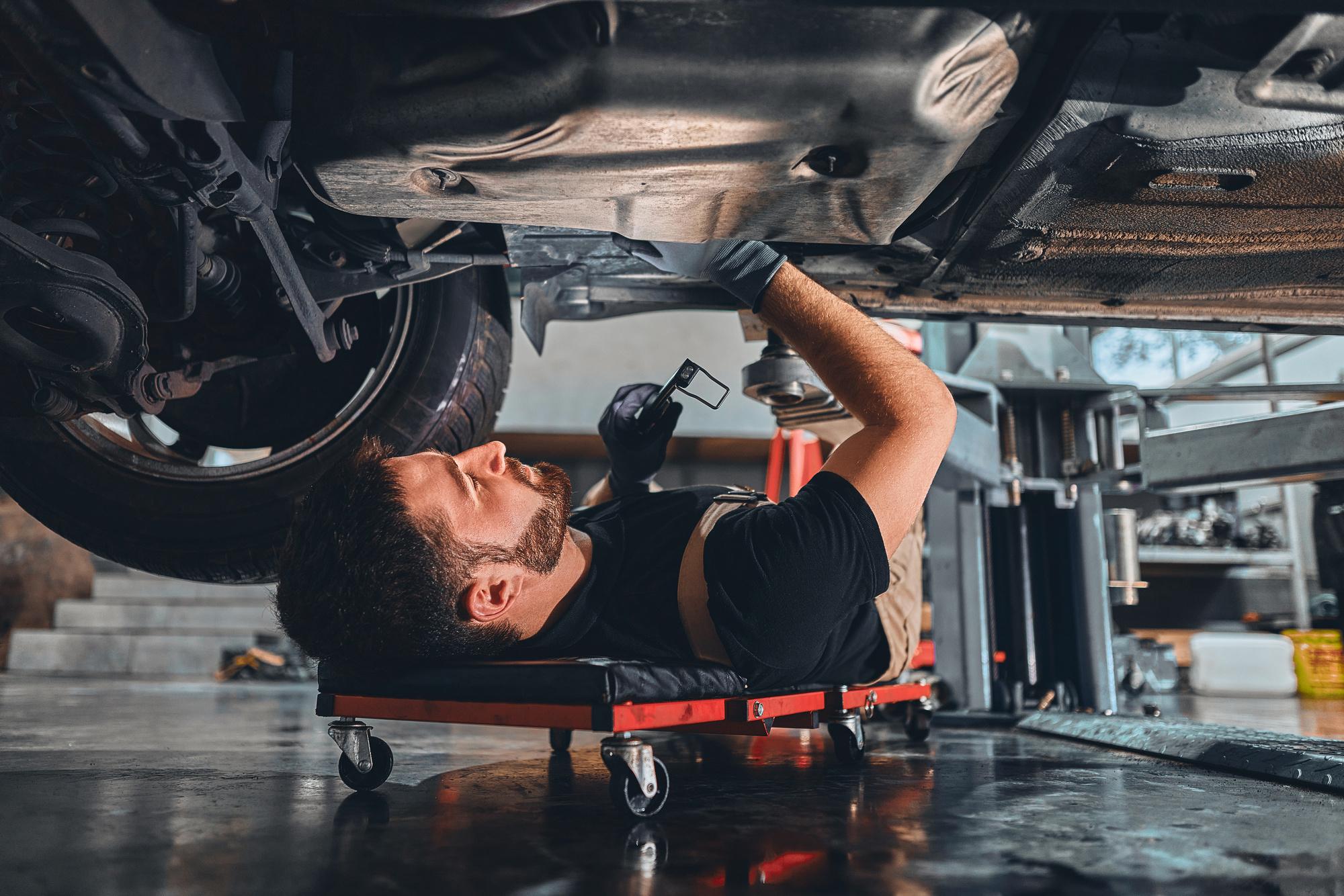 Mechanic repairs a car