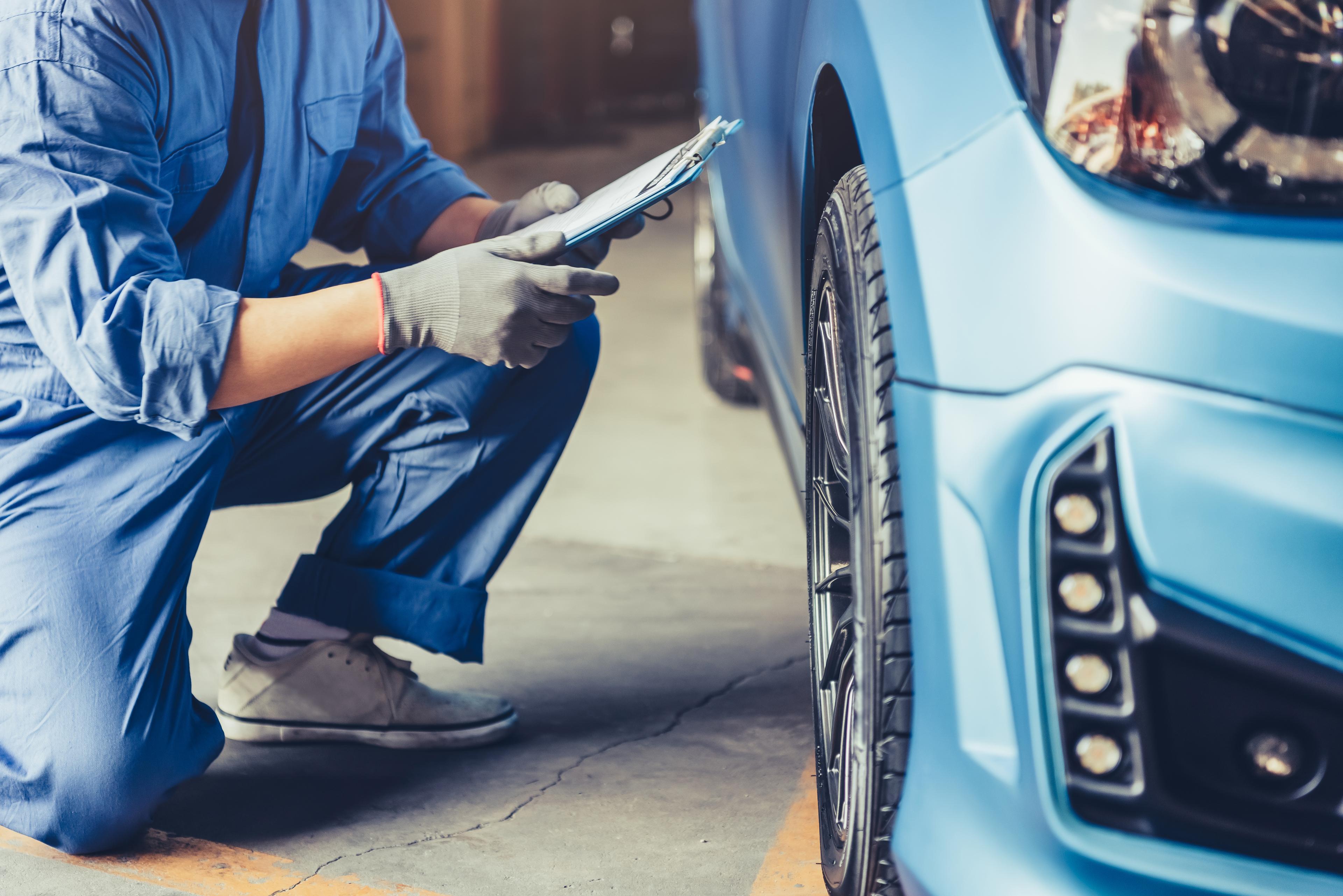 Mechanic inspecting a car