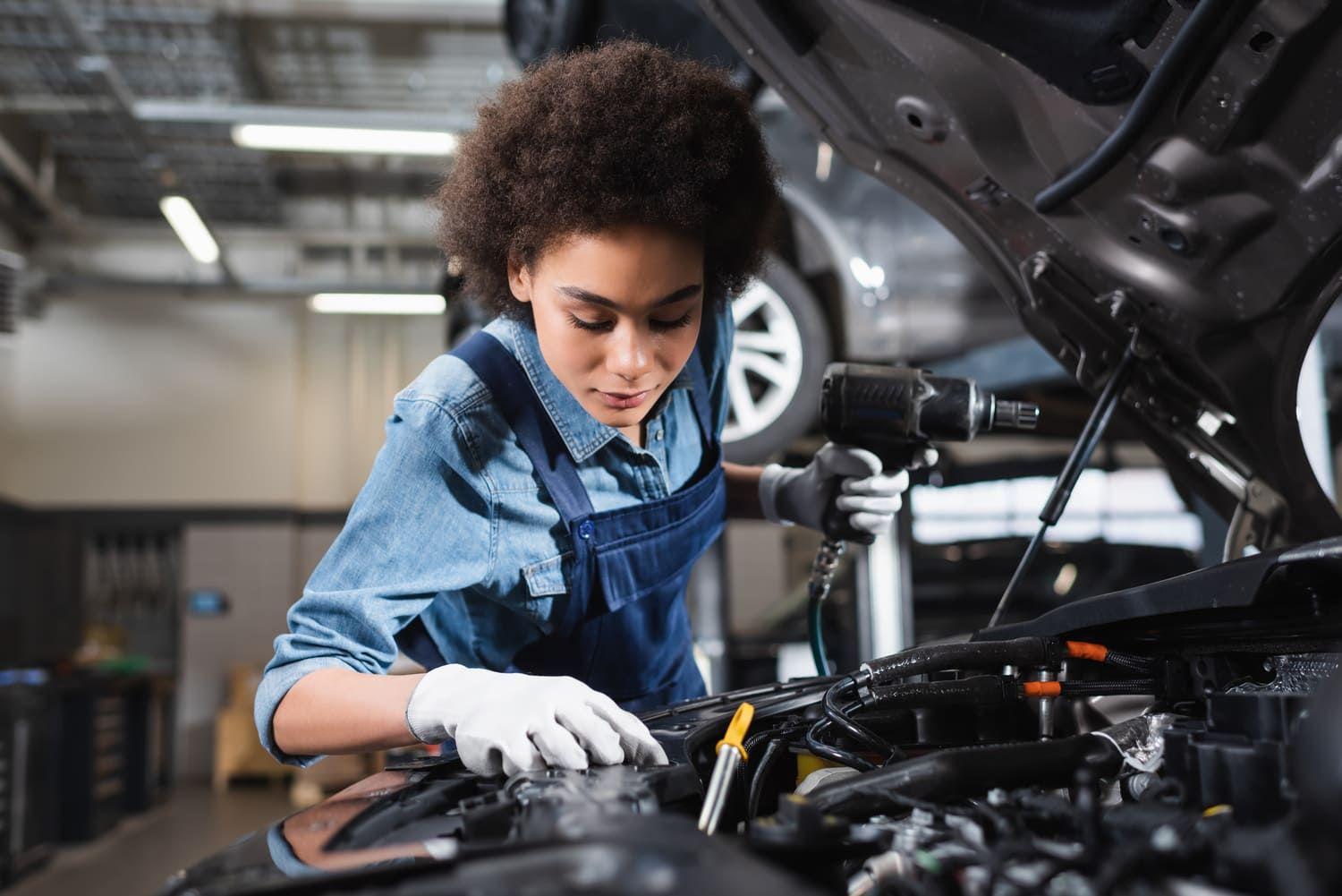 Mechanic looking at an engine